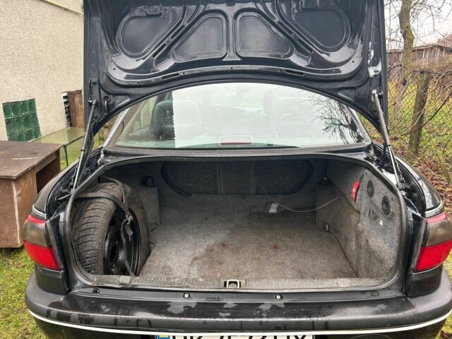 Черный Опель Омега, объемом двигателя 2.5 л и пробегом 274 тыс. км за 2000 $, фото 12 на Automoto.ua