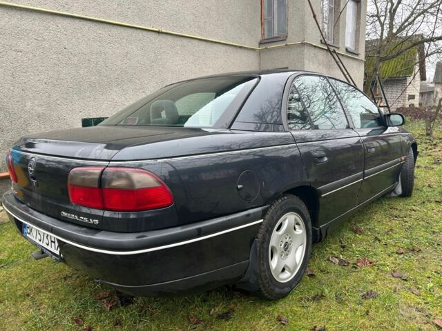 Черный Опель Омега, объемом двигателя 2.5 л и пробегом 274 тыс. км за 2000 $, фото 3 на Automoto.ua