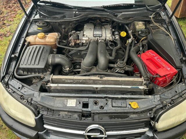 Черный Опель Омега, объемом двигателя 2.5 л и пробегом 274 тыс. км за 2000 $, фото 13 на Automoto.ua