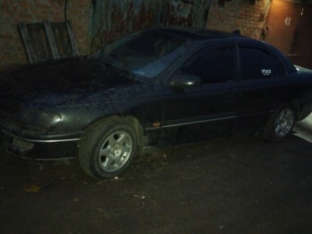 Черный Опель Омега, объемом двигателя 2 л и пробегом 300 тыс. км за 750 $, фото 1 на Automoto.ua