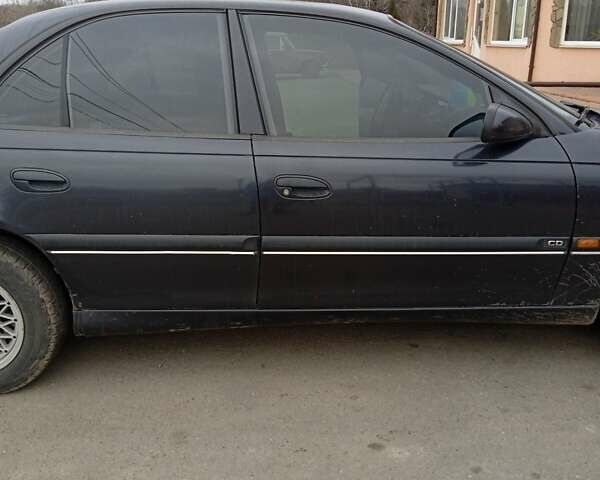 Черный Опель Омега, объемом двигателя 2.5 л и пробегом 328 тыс. км за 3000 $, фото 4 на Automoto.ua