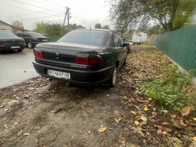 Черный Опель Омега, объемом двигателя 2.5 л и пробегом 378 тыс. км за 1500 $, фото 2 на Automoto.ua