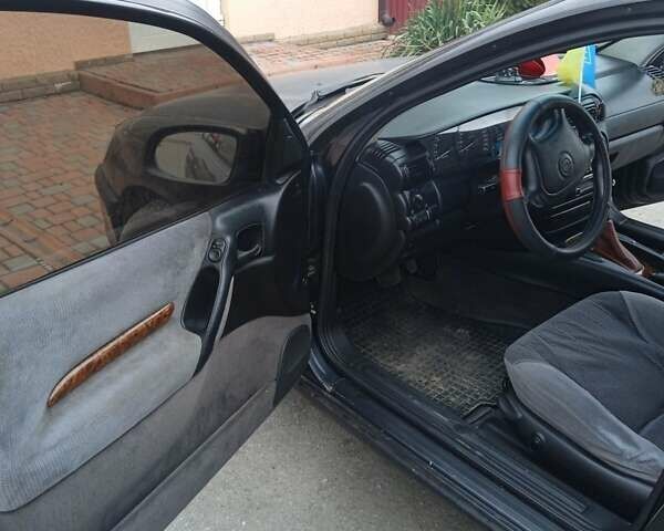 Черный Опель Омега, объемом двигателя 2.5 л и пробегом 328 тыс. км за 3000 $, фото 15 на Automoto.ua