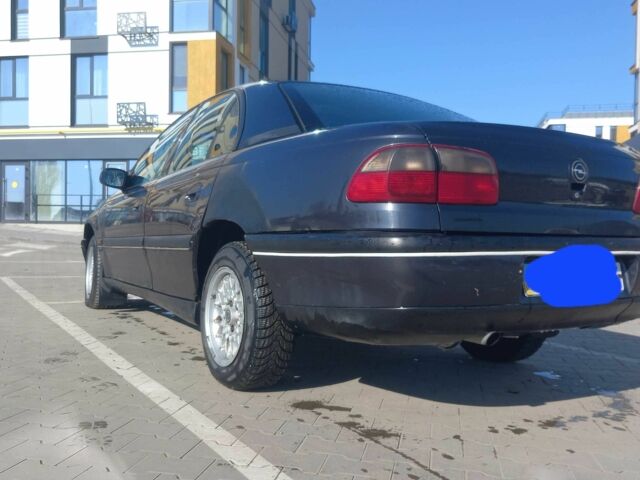 Черный Опель Омега, объемом двигателя 2 л и пробегом 100 тыс. км за 2100 $, фото 1 на Automoto.ua