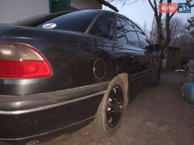 Черный Опель Омега, объемом двигателя 2.5 л и пробегом 500 тыс. км за 2100 $, фото 4 на Automoto.ua