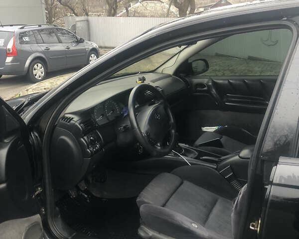 Черный Опель Омега, объемом двигателя 2 л и пробегом 298 тыс. км за 2399 $, фото 13 на Automoto.ua