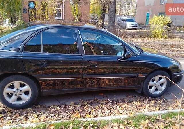 Чорний Опель Омега, об'ємом двигуна 2 л та пробігом 300 тис. км за 2600 $, фото 2 на Automoto.ua