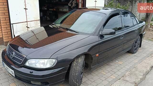 Чорний Опель Омега, об'ємом двигуна 3 л та пробігом 260 тис. км за 3500 $, фото 1 на Automoto.ua