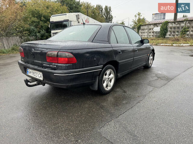 Черный Опель Омега, объемом двигателя 2.5 л и пробегом 400 тыс. км за 1499 $, фото 5 на Automoto.ua