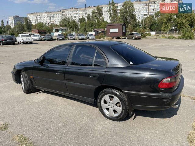 Чорний Опель Омега, об'ємом двигуна 2 л та пробігом 273 тис. км за 3000 $, фото 4 на Automoto.ua