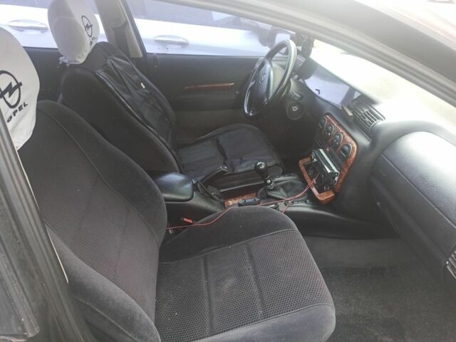 Чорний Опель Омега, об'ємом двигуна 2 л та пробігом 300 тис. км за 1450 $, фото 4 на Automoto.ua