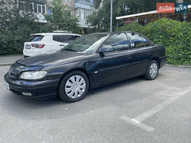Черный Опель Омега, объемом двигателя 2.2 л и пробегом 262 тыс. км за 3300 $, фото 6 на Automoto.ua