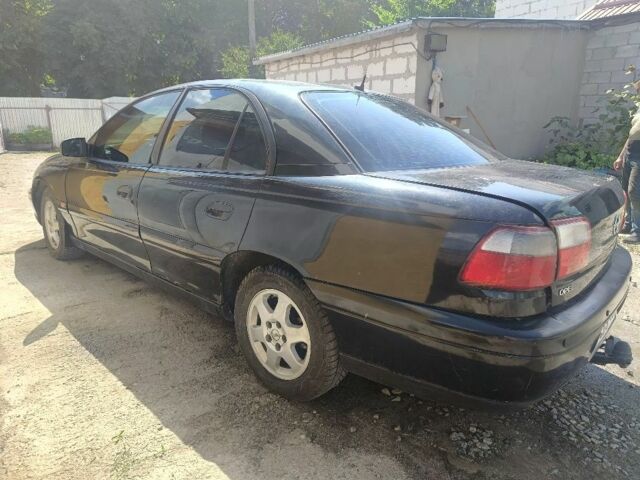 Черный Опель Омега, объемом двигателя 2.2 л и пробегом 300 тыс. км за 1200 $, фото 8 на Automoto.ua