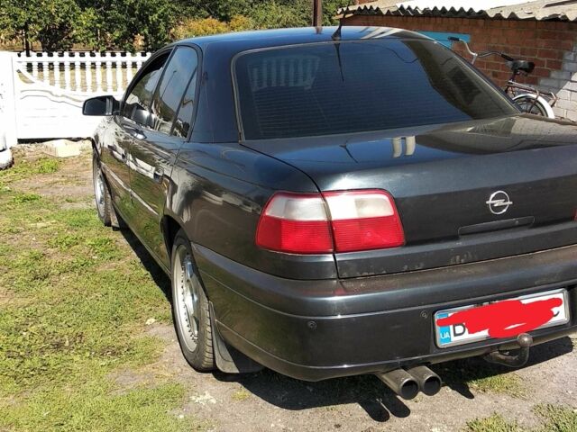 Черный Опель Омега, объемом двигателя 2.5 л и пробегом 300 тыс. км за 3500 $, фото 1 на Automoto.ua