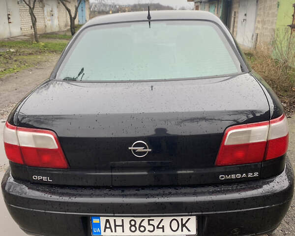 Черный Опель Омега, объемом двигателя 2.2 л и пробегом 313 тыс. км за 3200 $, фото 4 на Automoto.ua