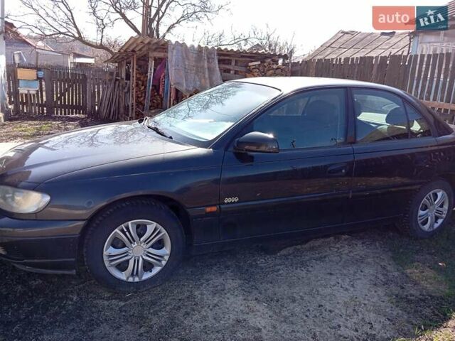 Черный Опель Омега, объемом двигателя 2.2 л и пробегом 330 тыс. км за 2500 $, фото 1 на Automoto.ua