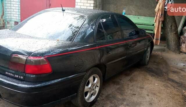 Черный Опель Омега, объемом двигателя 2.5 л и пробегом 400 тыс. км за 3000 $, фото 3 на Automoto.ua