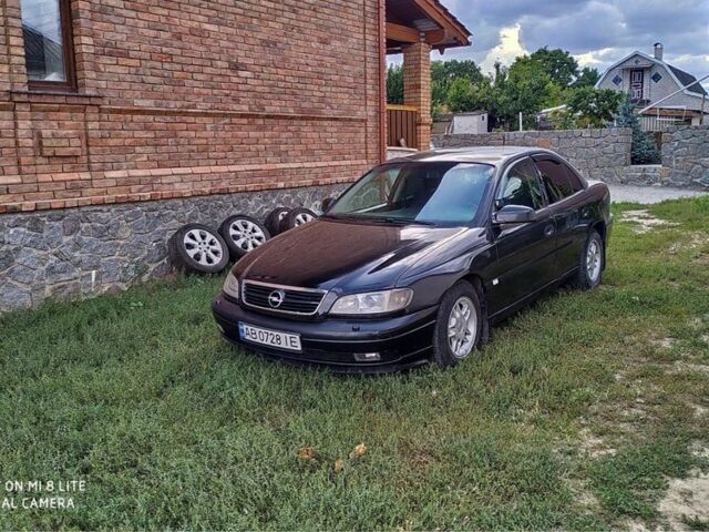 Черный Опель Омега, объемом двигателя 2.2 л и пробегом 274 тыс. км за 3000 $, фото 14 на Automoto.ua