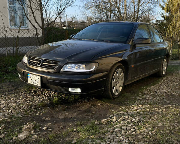 Черный Опель Омега, объемом двигателя 2.5 л и пробегом 287 тыс. км за 3900 $, фото 5 на Automoto.ua