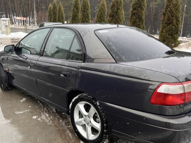 Черный Опель Омега, объемом двигателя 2.5 л и пробегом 293 тыс. км за 3000 $, фото 6 на Automoto.ua