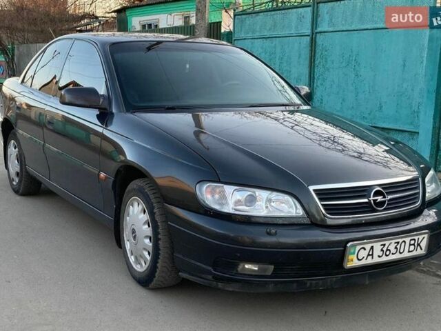 Черный Опель Омега, объемом двигателя 2.2 л и пробегом 380 тыс. км за 3999 $, фото 3 на Automoto.ua