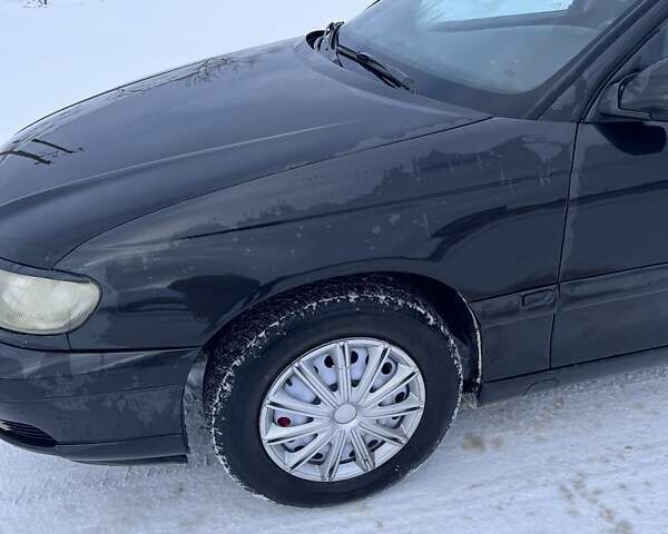 Черный Опель Омега, объемом двигателя 2.6 л и пробегом 250 тыс. км за 2200 $, фото 2 на Automoto.ua