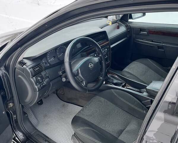 Чорний Опель Омега, об'ємом двигуна 2.6 л та пробігом 250 тис. км за 2300 $, фото 20 на Automoto.ua