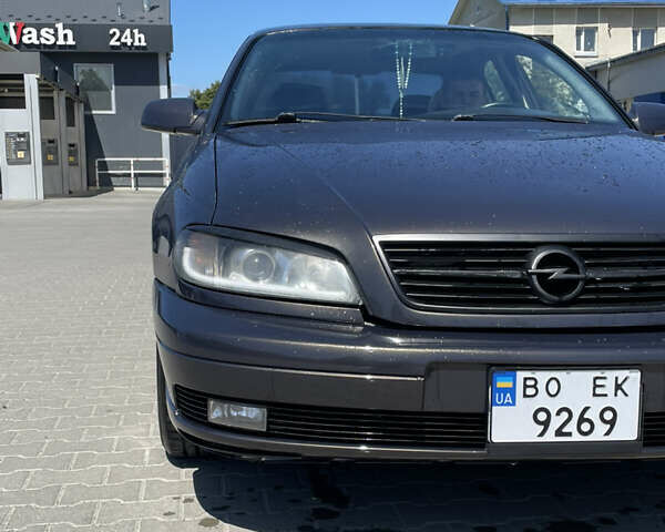 Черный Опель Омега, объемом двигателя 2.5 л и пробегом 287 тыс. км за 3900 $, фото 2 на Automoto.ua