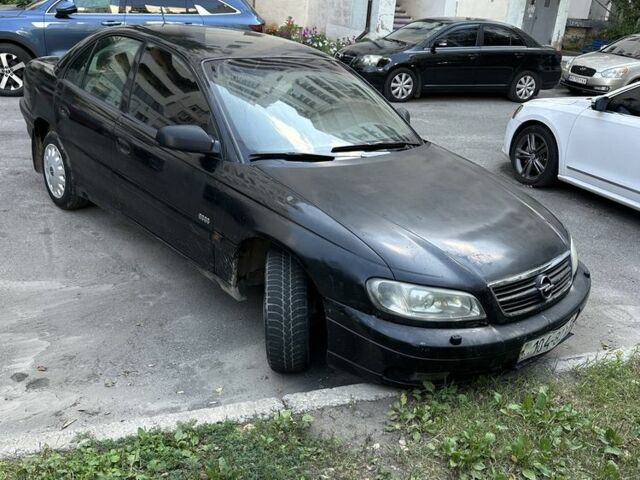 Черный Опель Омега, объемом двигателя 2.5 л и пробегом 333 тыс. км за 1355 $, фото 2 на Automoto.ua
