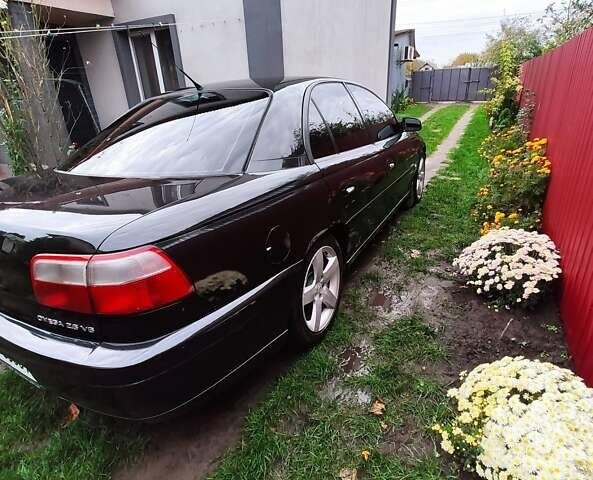 Черный Опель Омега, объемом двигателя 2.6 л и пробегом 434 тыс. км за 3500 $, фото 13 на Automoto.ua