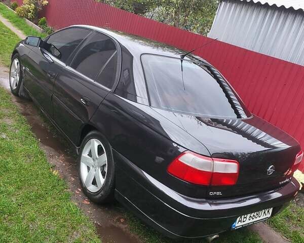 Черный Опель Омега, объемом двигателя 2.6 л и пробегом 434 тыс. км за 3500 $, фото 14 на Automoto.ua