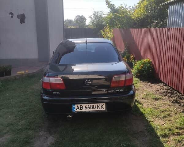 Черный Опель Омега, объемом двигателя 2.6 л и пробегом 434 тыс. км за 3500 $, фото 9 на Automoto.ua