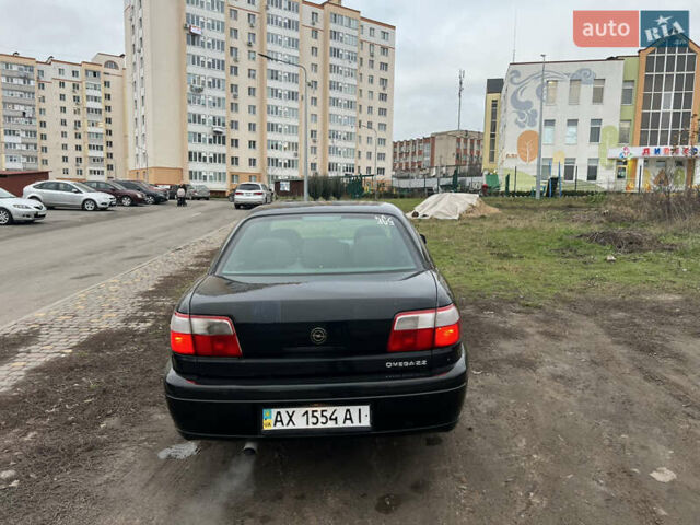 Черный Опель Омега, объемом двигателя 2.2 л и пробегом 319 тыс. км за 2000 $, фото 8 на Automoto.ua