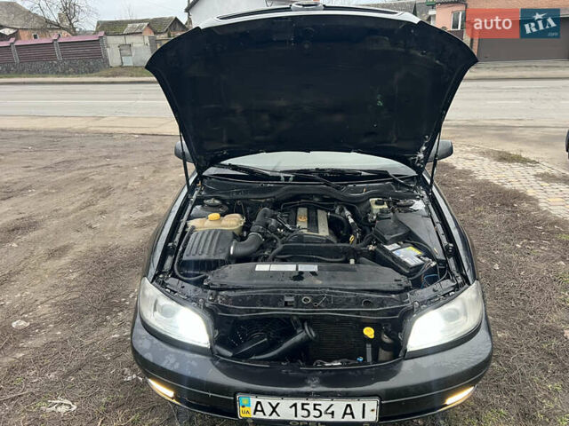 Черный Опель Омега, объемом двигателя 2.2 л и пробегом 319 тыс. км за 2000 $, фото 19 на Automoto.ua