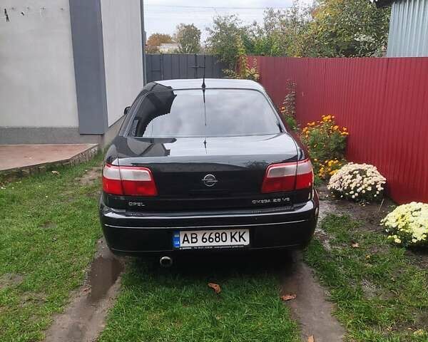 Черный Опель Омега, объемом двигателя 2.6 л и пробегом 434 тыс. км за 3500 $, фото 15 на Automoto.ua