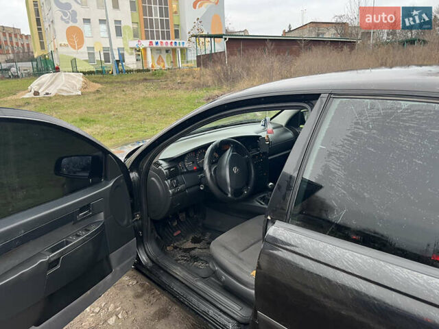 Черный Опель Омега, объемом двигателя 2.2 л и пробегом 319 тыс. км за 2000 $, фото 12 на Automoto.ua