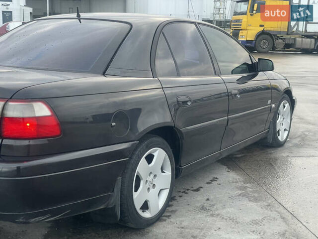 Черный Опель Омега, объемом двигателя 2.17 л и пробегом 374 тыс. км за 3100 $, фото 8 на Automoto.ua