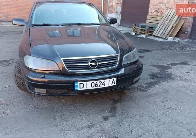 Черный Опель Омега, объемом двигателя 2.2 л и пробегом 356 тыс. км за 3000 $, фото 3 на Automoto.ua