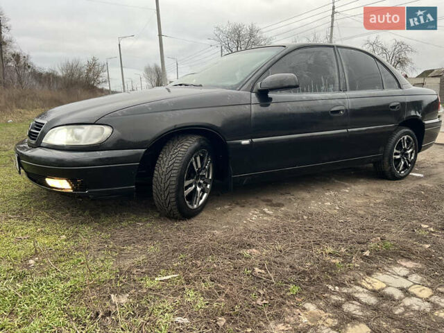 Черный Опель Омега, объемом двигателя 2.2 л и пробегом 319 тыс. км за 2000 $, фото 2 на Automoto.ua