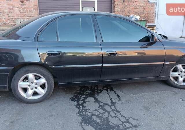 Черный Опель Омега, объемом двигателя 2.2 л и пробегом 356 тыс. км за 2800 $, фото 1 на Automoto.ua