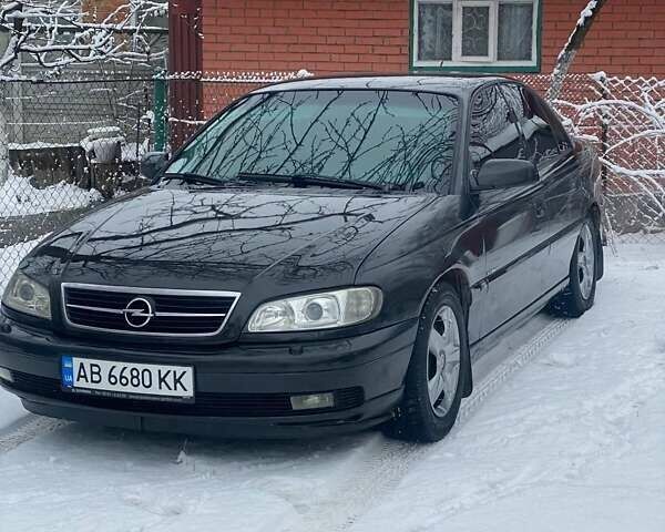 Черный Опель Омега, объемом двигателя 2.6 л и пробегом 434 тыс. км за 3500 $, фото 7 на Automoto.ua