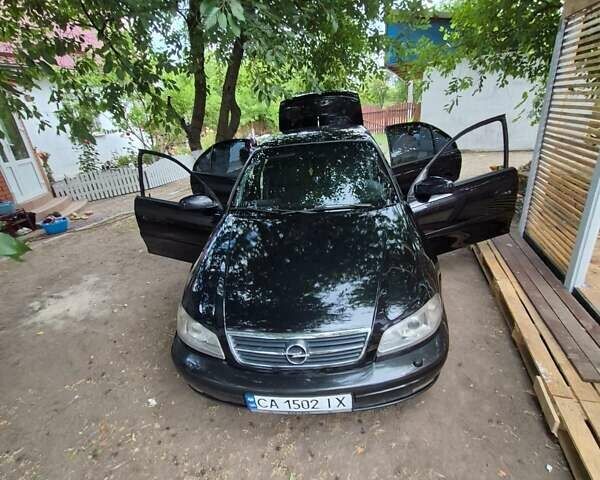 Черный Опель Омега, объемом двигателя 2.5 л и пробегом 300 тыс. км за 4000 $, фото 10 на Automoto.ua