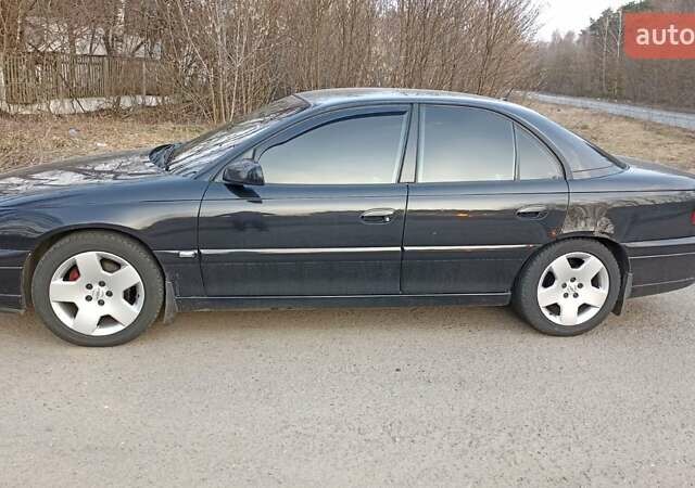 Черный Опель Омега, объемом двигателя 2.5 л и пробегом 295 тыс. км за 4400 $, фото 1 на Automoto.ua