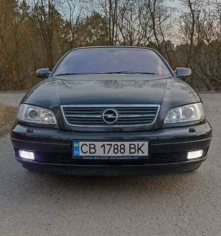 Черный Опель Омега, объемом двигателя 2.5 л и пробегом 295 тыс. км за 4400 $, фото 7 на Automoto.ua