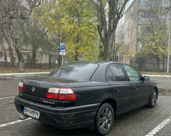 Черный Опель Омега, объемом двигателя 2.2 л и пробегом 320 тыс. км за 2999 $, фото 1 на Automoto.ua