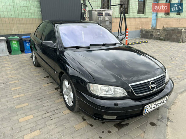 Черный Опель Омега, объемом двигателя 2.5 л и пробегом 280 тыс. км за 4300 $, фото 8 на Automoto.ua