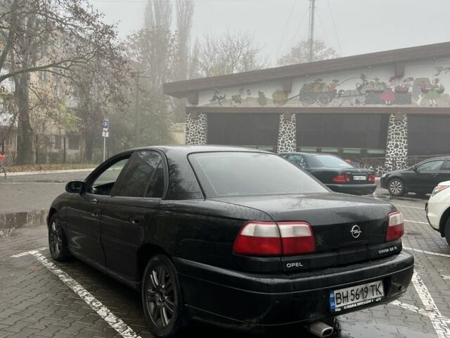 Черный Опель Омега, объемом двигателя 2.2 л и пробегом 222 тыс. км за 2999 $, фото 1 на Automoto.ua