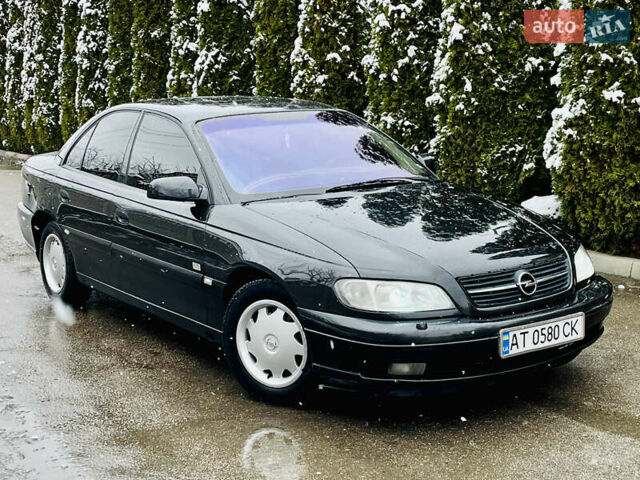 Черный Опель Омега, объемом двигателя 2.2 л и пробегом 290 тыс. км за 2350 $, фото 29 на Automoto.ua
