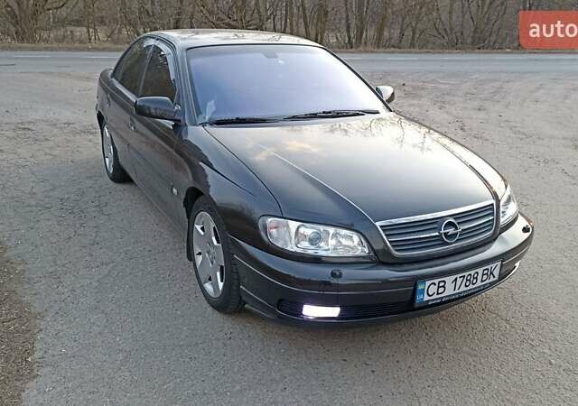 Черный Опель Омега, объемом двигателя 2.5 л и пробегом 295 тыс. км за 4400 $, фото 2 на Automoto.ua