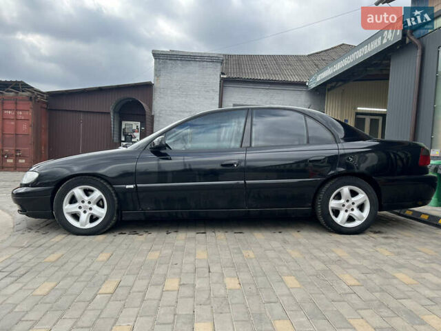 Черный Опель Омега, объемом двигателя 2.5 л и пробегом 280 тыс. км за 4300 $, фото 3 на Automoto.ua